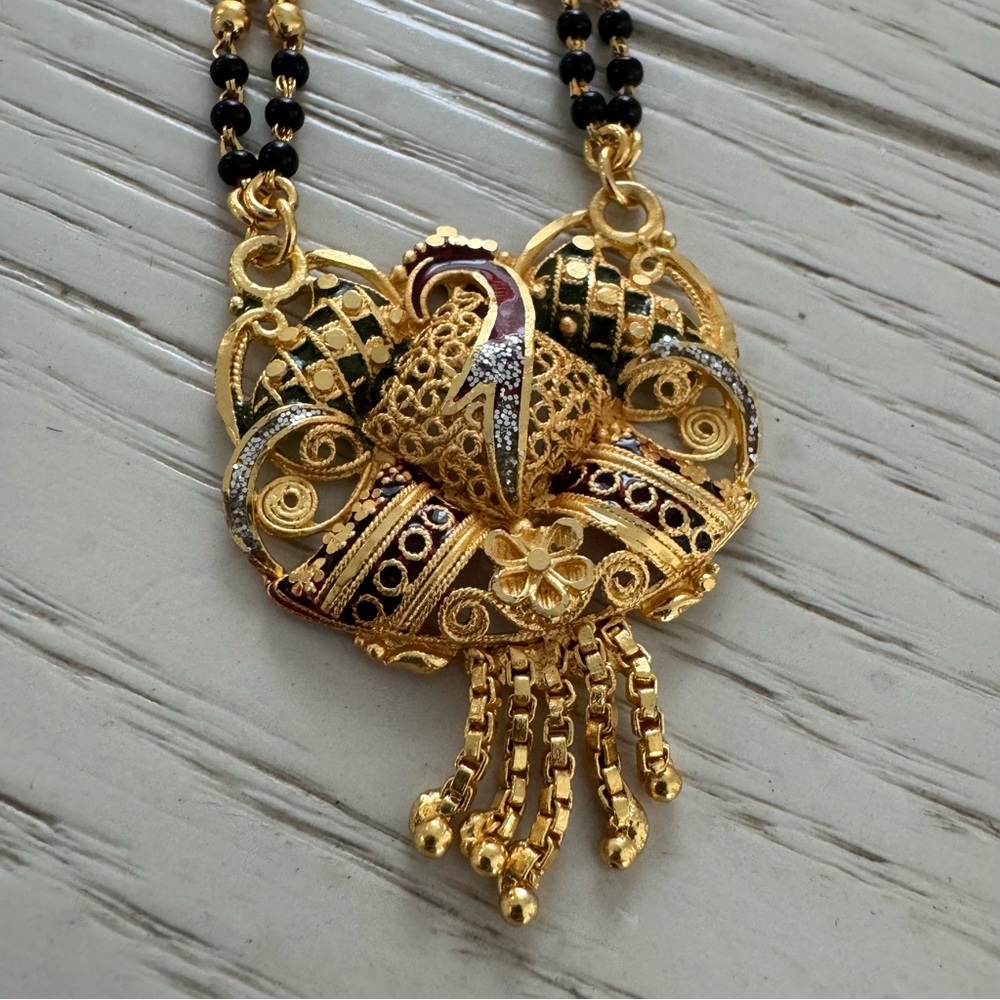 Elegant Gold and Black Peacock Pendant Necklace